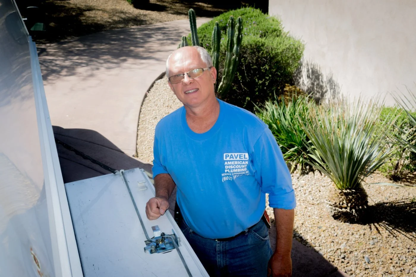 Pavel Farcas at his American Discount Plumbing service truck in Phoenix.