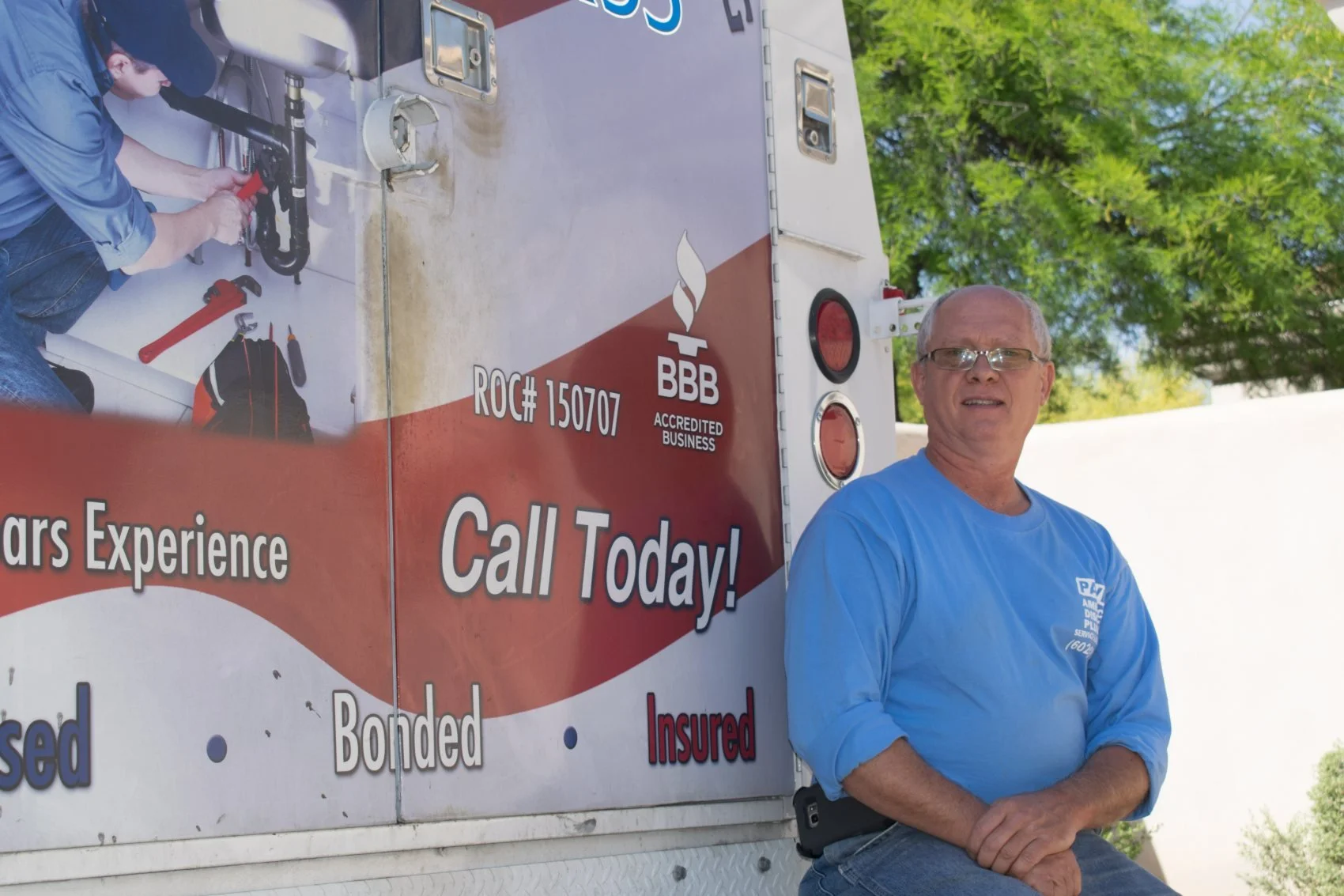 Pavel Farcas at the American Discount Plumbing service truck in Phoenix.