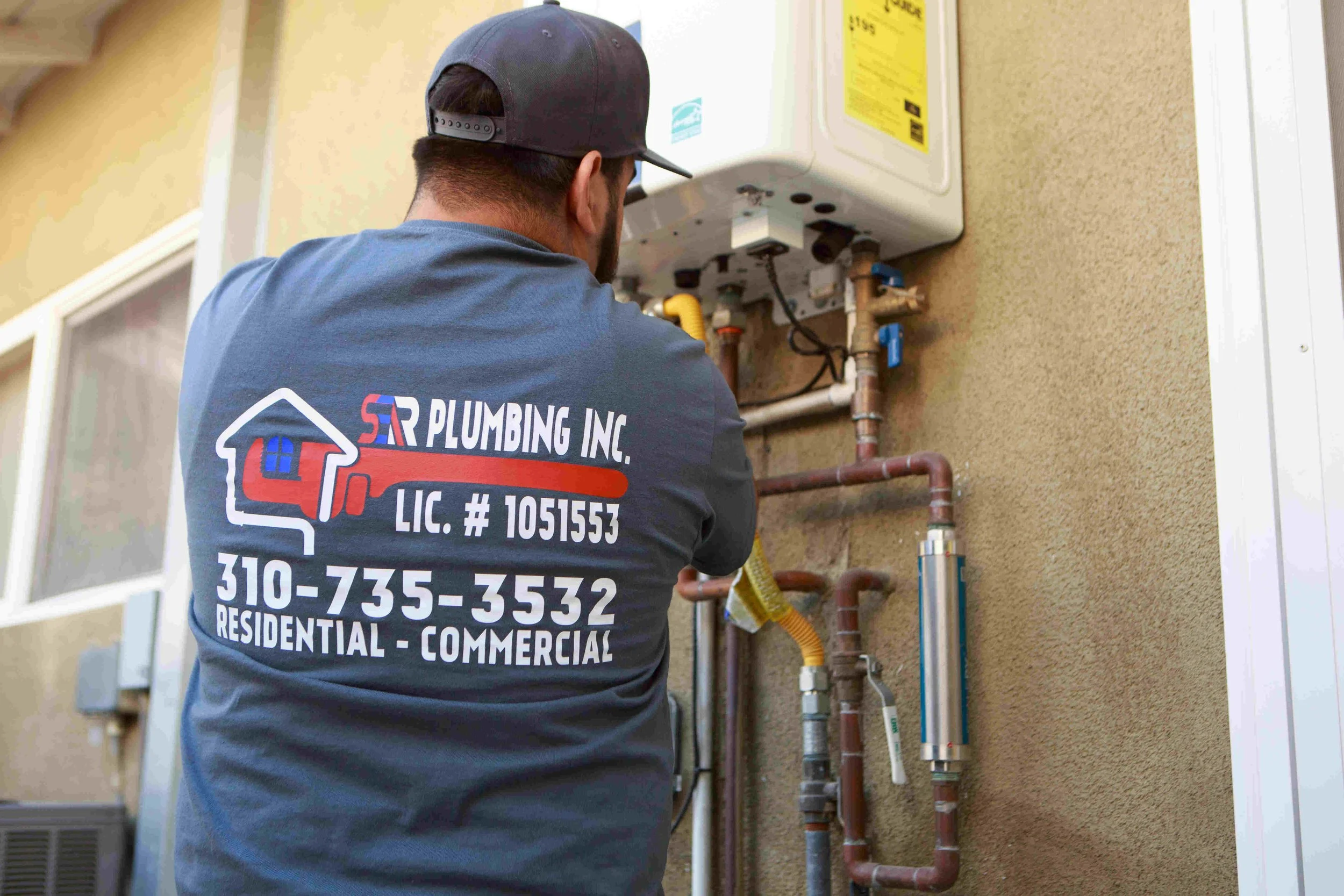 Ser Plumbing plumber working on a residential supply line