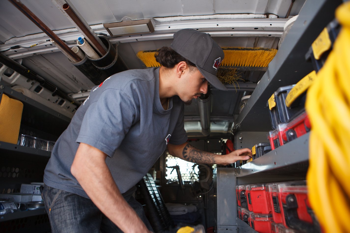 Ser Plumbing selecting diagnostic equipment in the service van