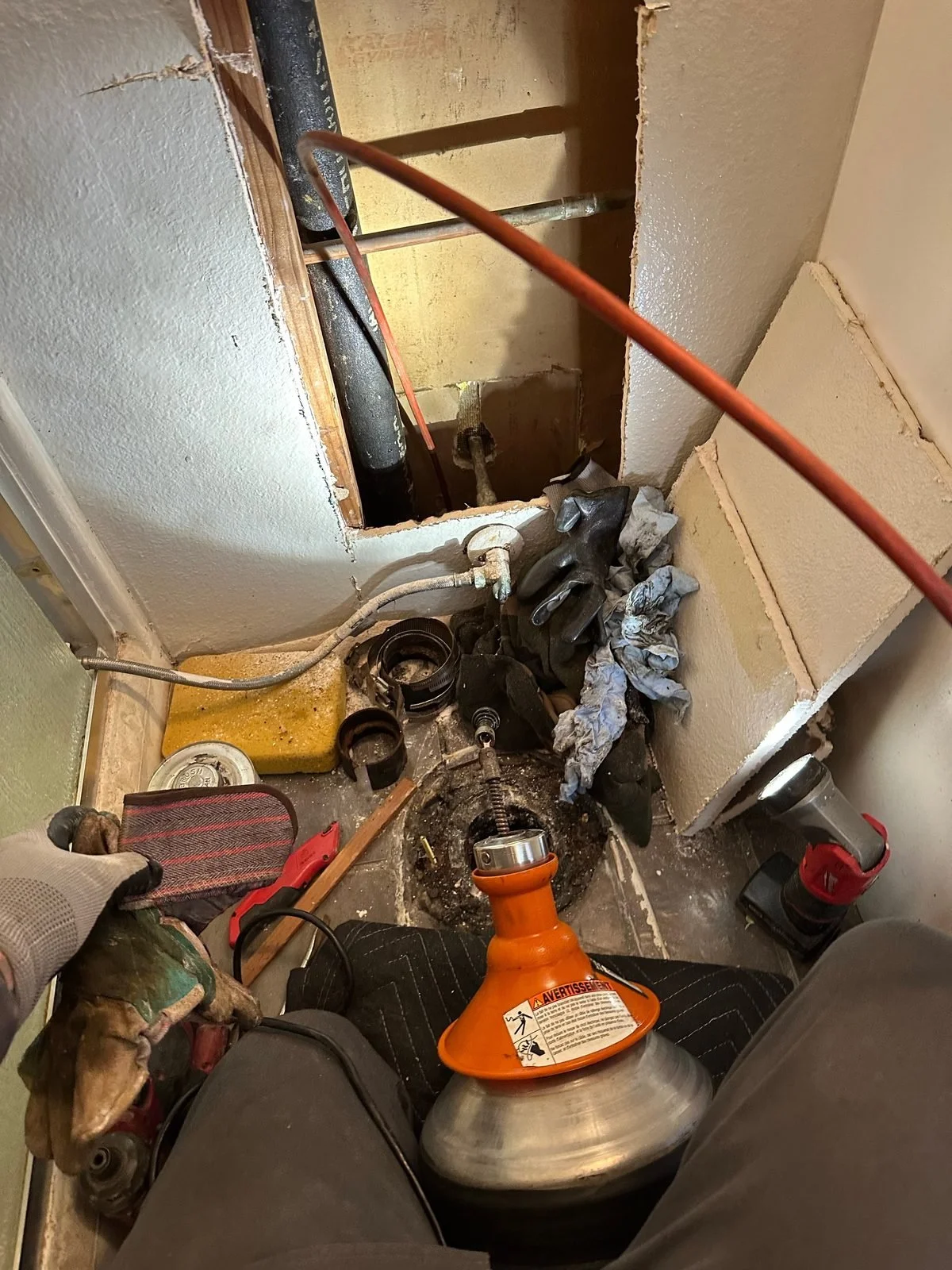 Ser Plumbing plumber pulling parts from the stocked service van