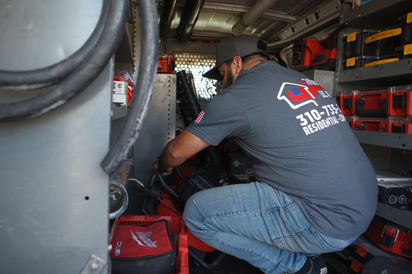 Ser Plumbing plumber preparing sewer equipment in Paramount, CA