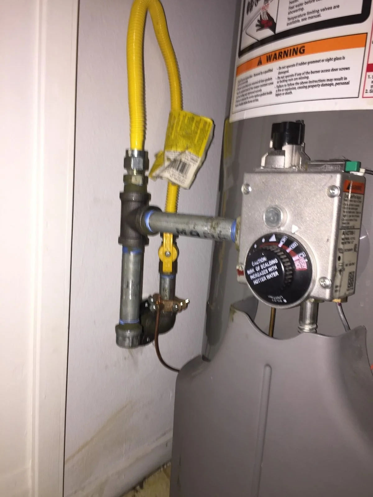 Gas control valve and flex connector on a newly installed water heater — Ser Plumbing, Southeast LA County