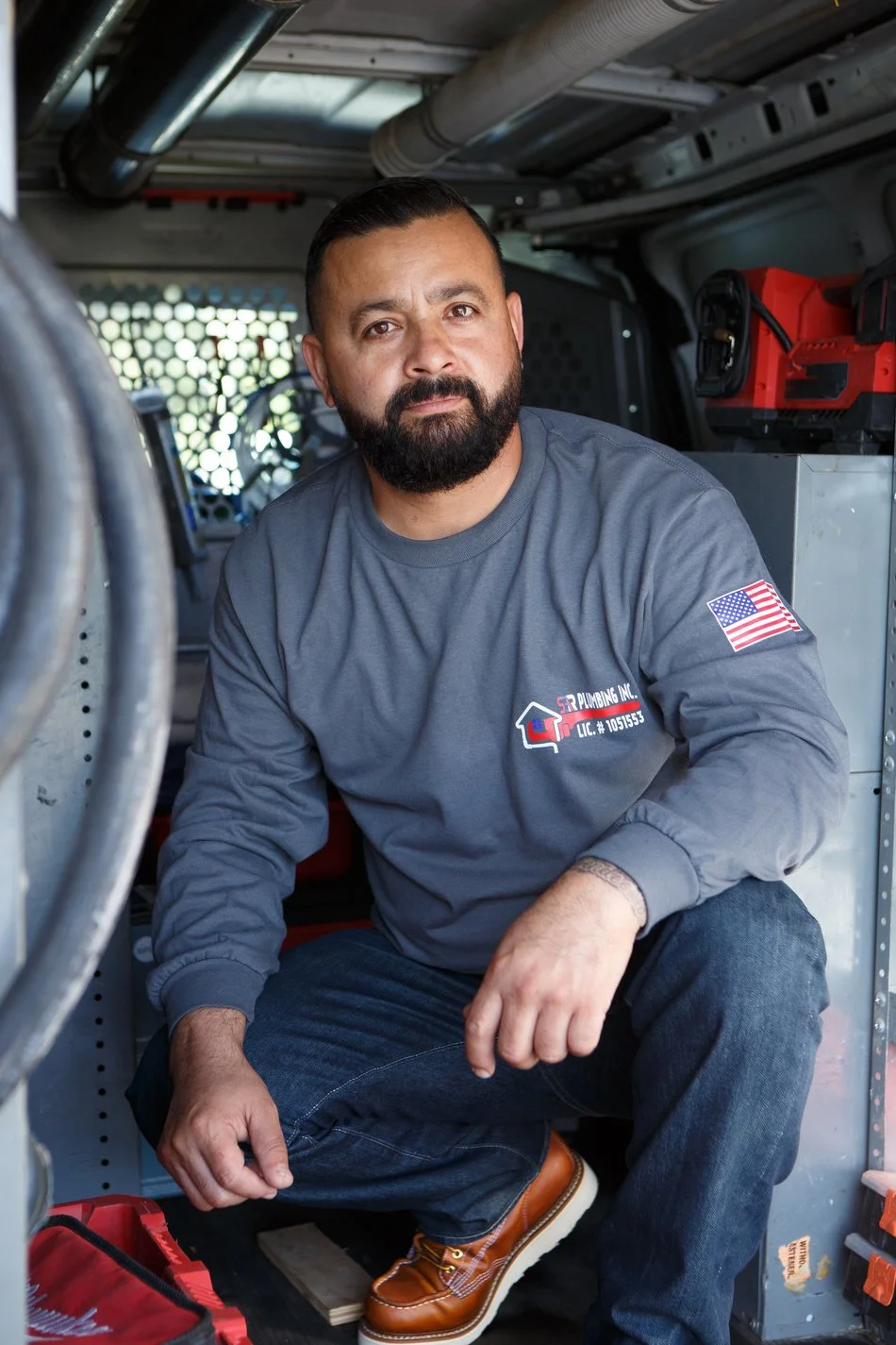 Jose Luis Serrano with diagnostic gear in the Ser Plumbing van