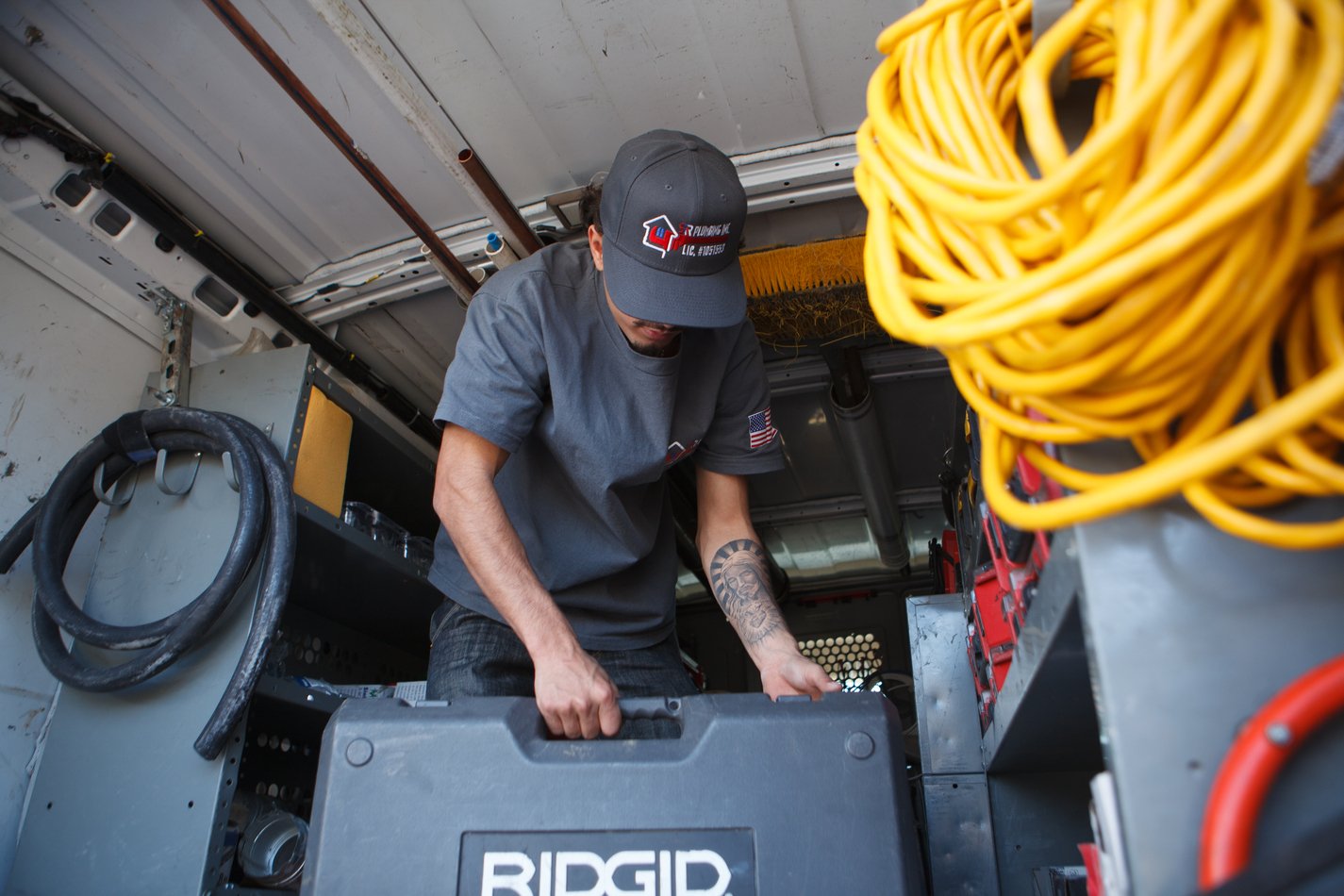 Ser Plumbing technician working from the service van