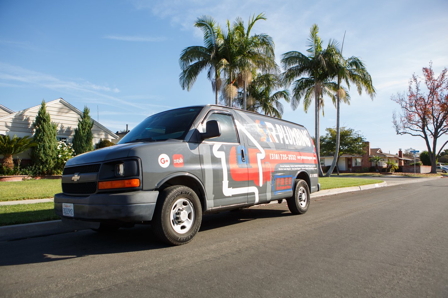Ser Plumbing service van parked on a residential street