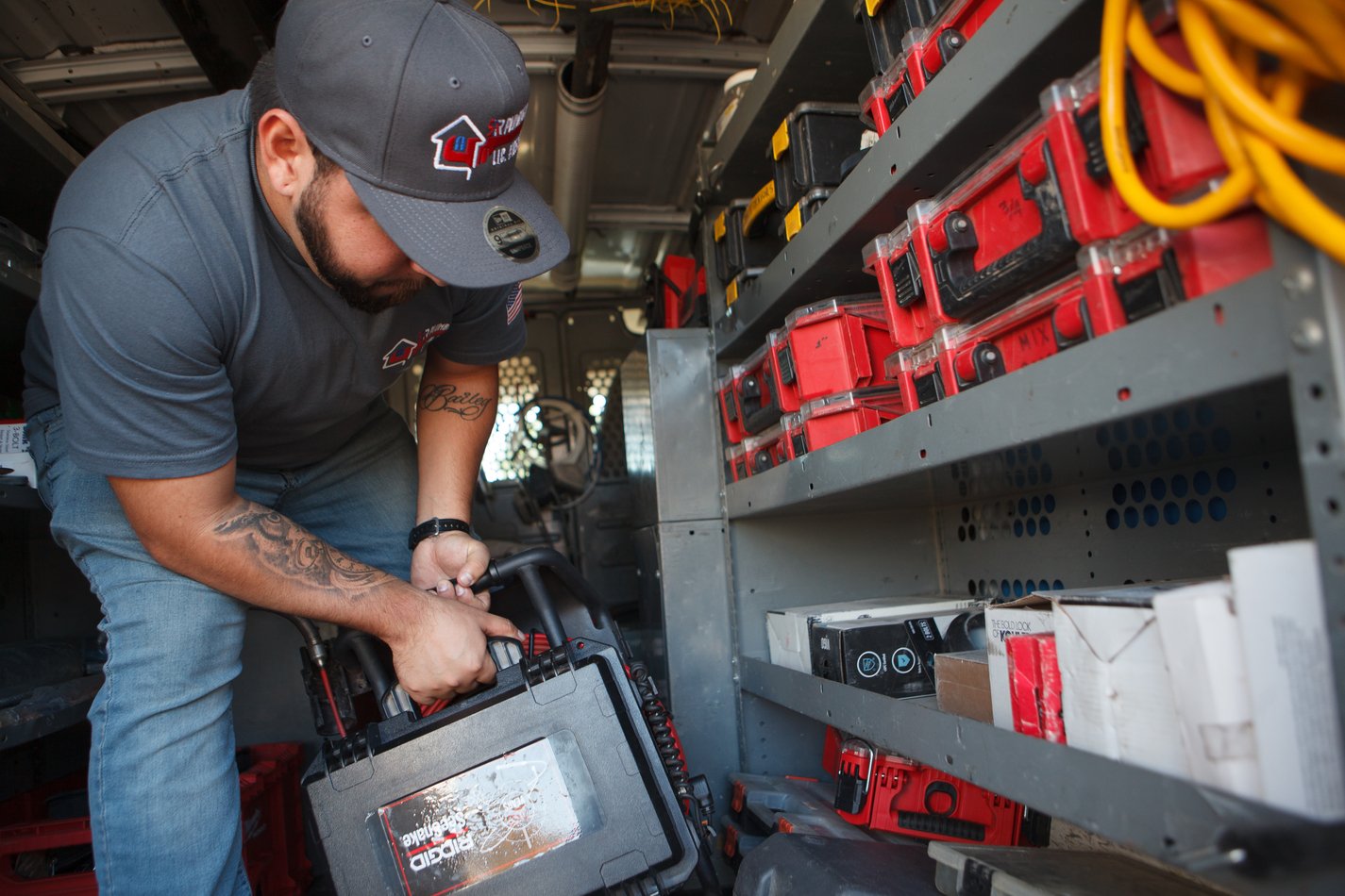 Ser Plumbing technician preparing diagnostic equipment in the van