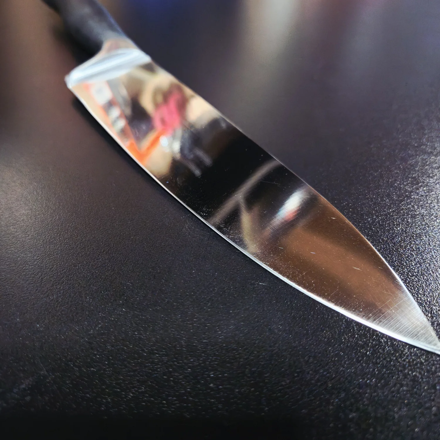 Close-up of a polished kitchen knife blade at Apex.