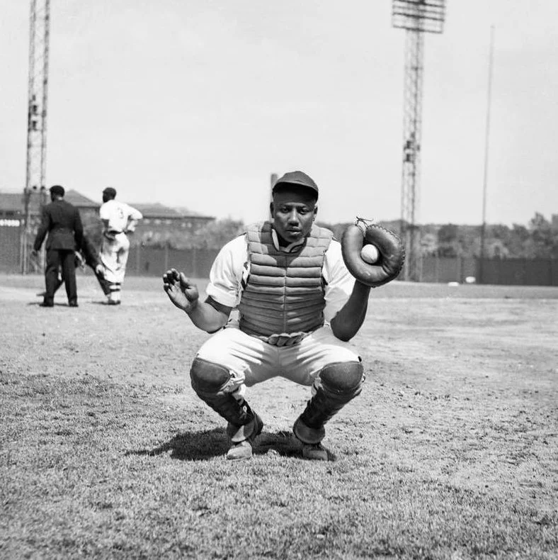 Josh Gibson crouching in catcher's gear
