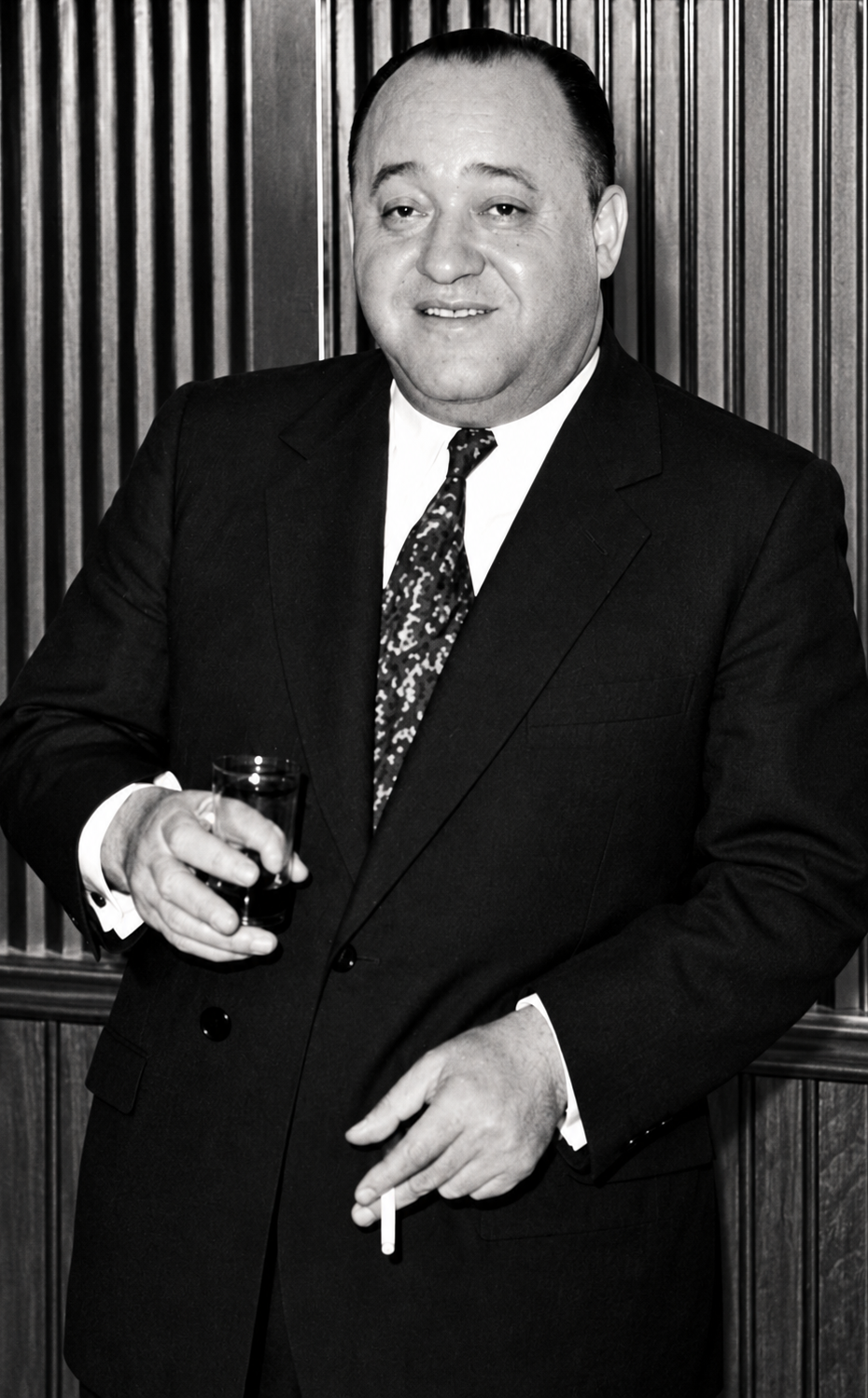 Gus Greenlee holding a drink