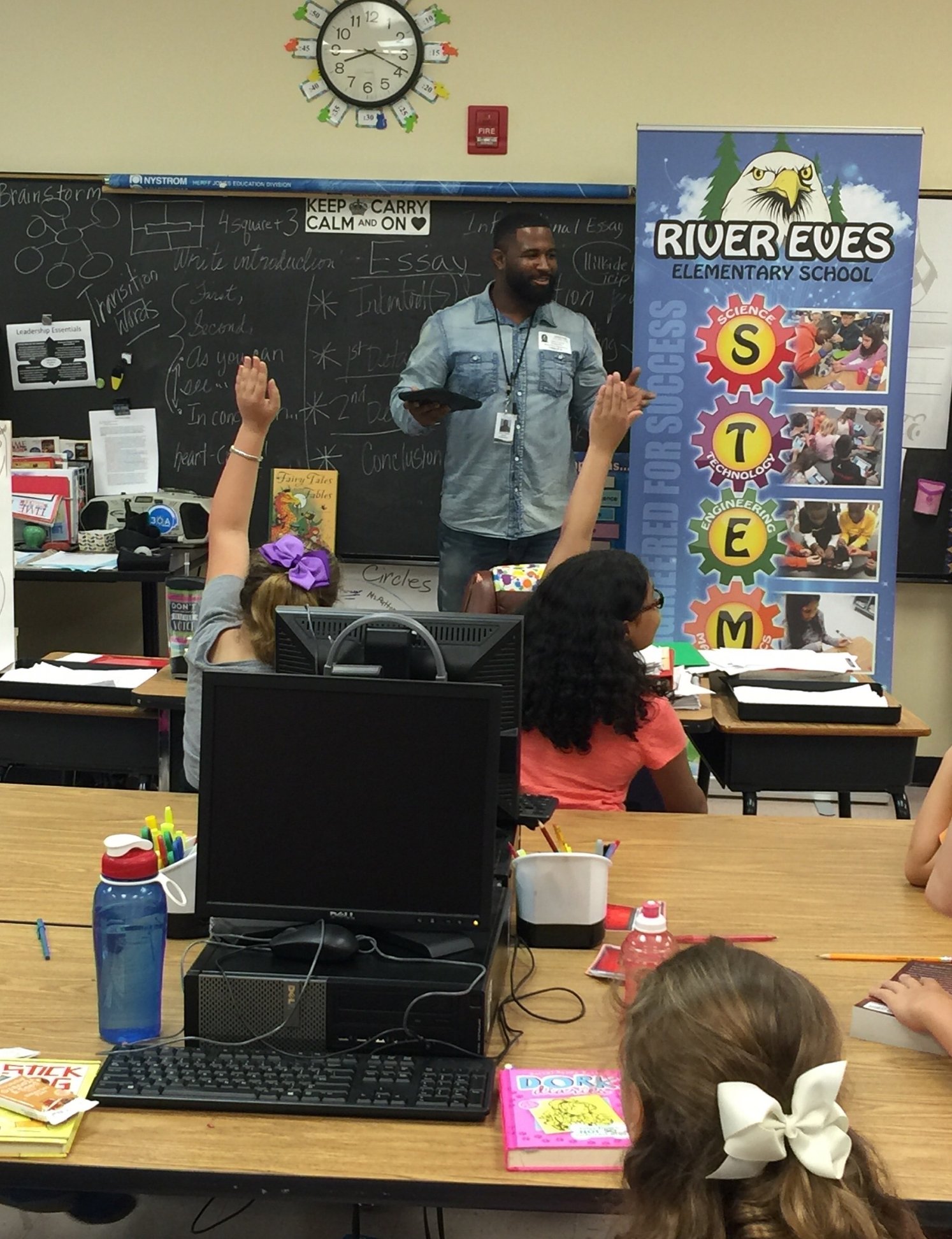 Justin speaking with students during career day