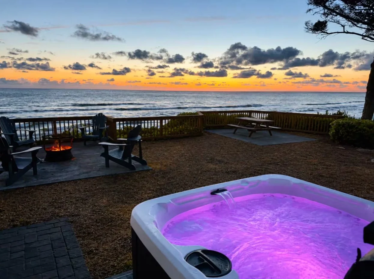 Oceanfront hot tub at Pinecrest at sunset