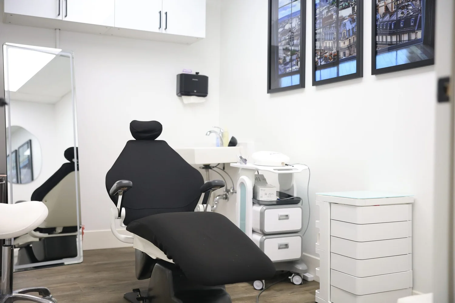 Clean med spa treatment room with chair and equipment