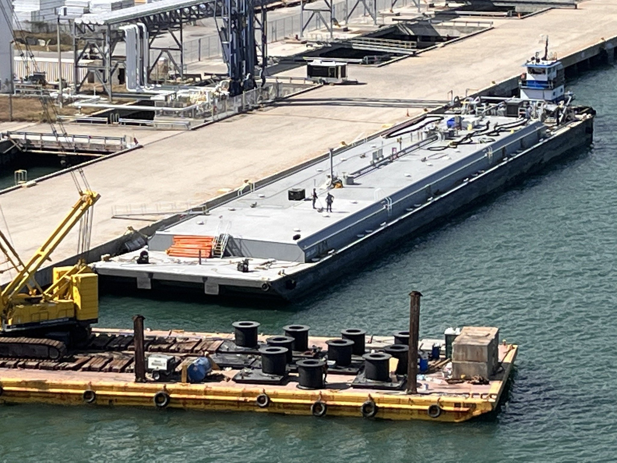 Environmental project barge at an industrial waterfront