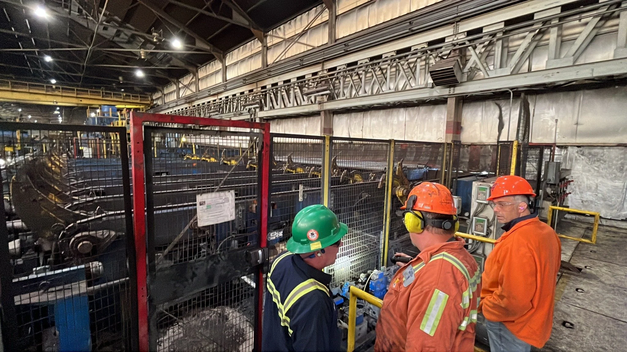 Industrial response team reviewing equipment