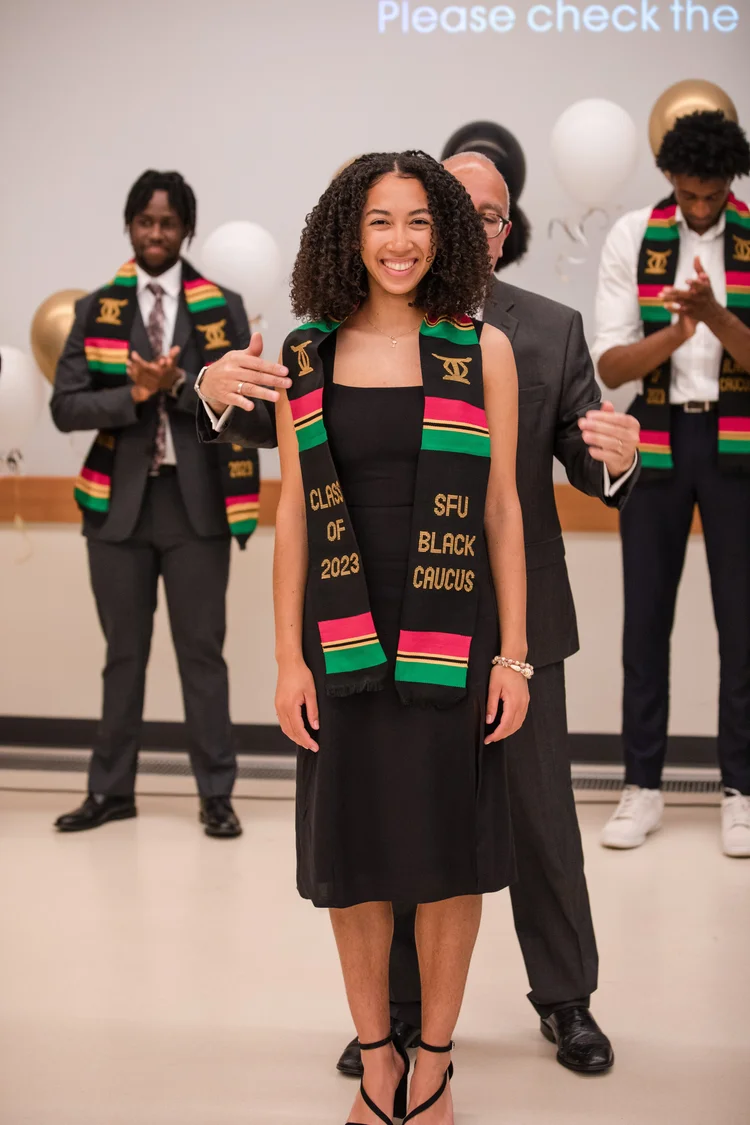 Graduates wearing stoles at the SFU SOCA graduation.