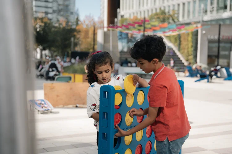 Children playing a giant stacking game at Crave Festival.