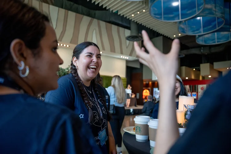 Guests laughing together at a Captain Scott Legacy Society event.