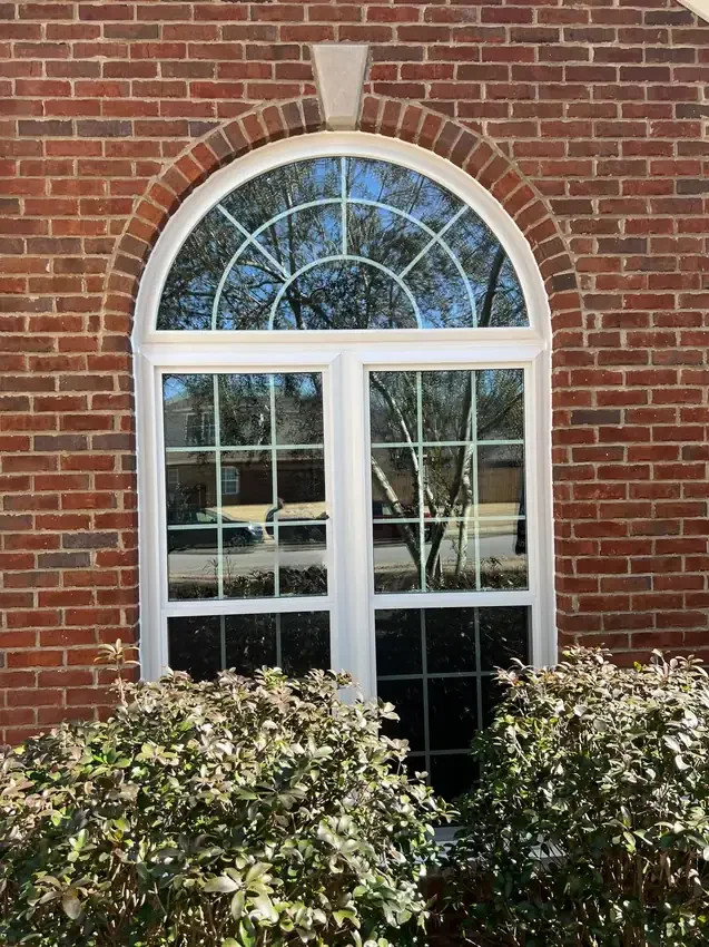 Large arched window composition in brick