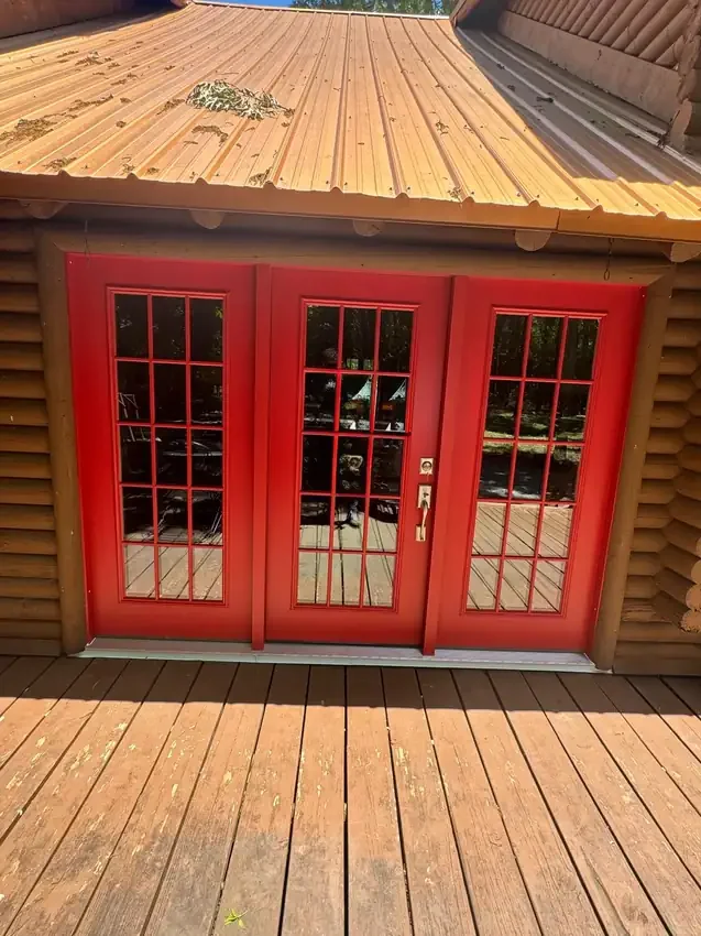 Red multi-glass entrance on a log-style home
