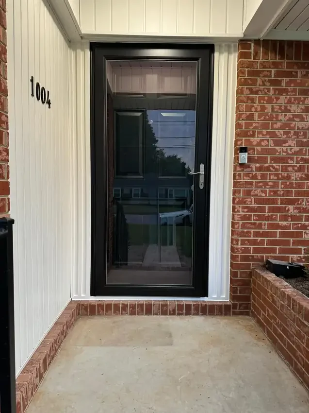 Finished black storm door