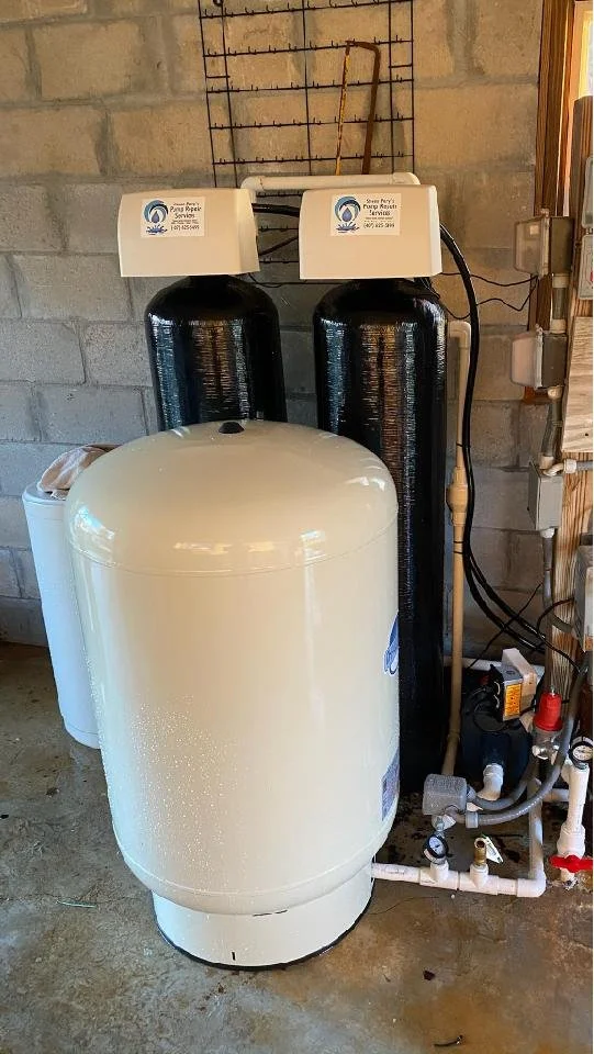 Twin black treatment tanks installed indoors - Pump Repair Services, Orlando FL