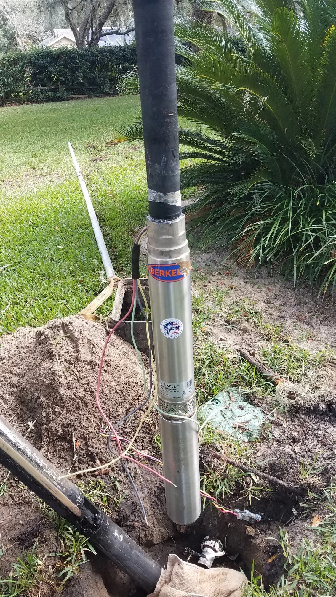 Well head and irrigation line in a yard - Pump Repair Services, Orlando FL