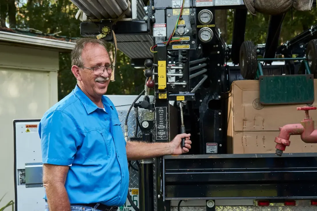 Steven Perry at the hoist controls on a Central Florida well service call