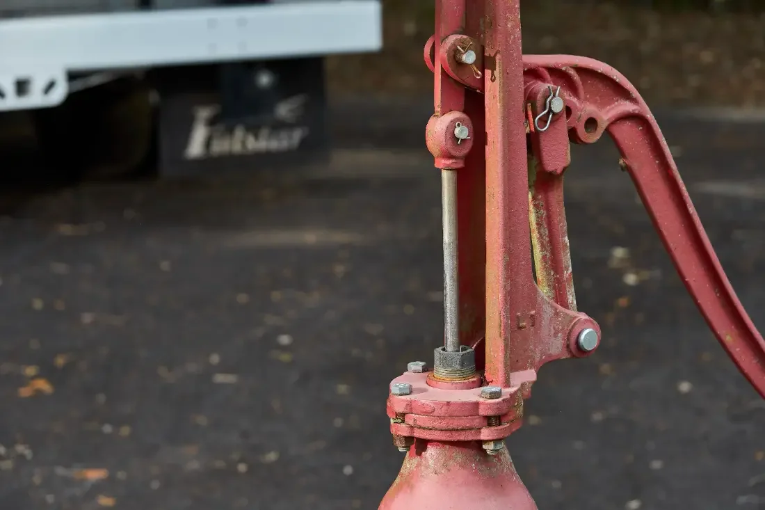 Drop pipe and wire spools staged beneath the boom on a Central Florida well job