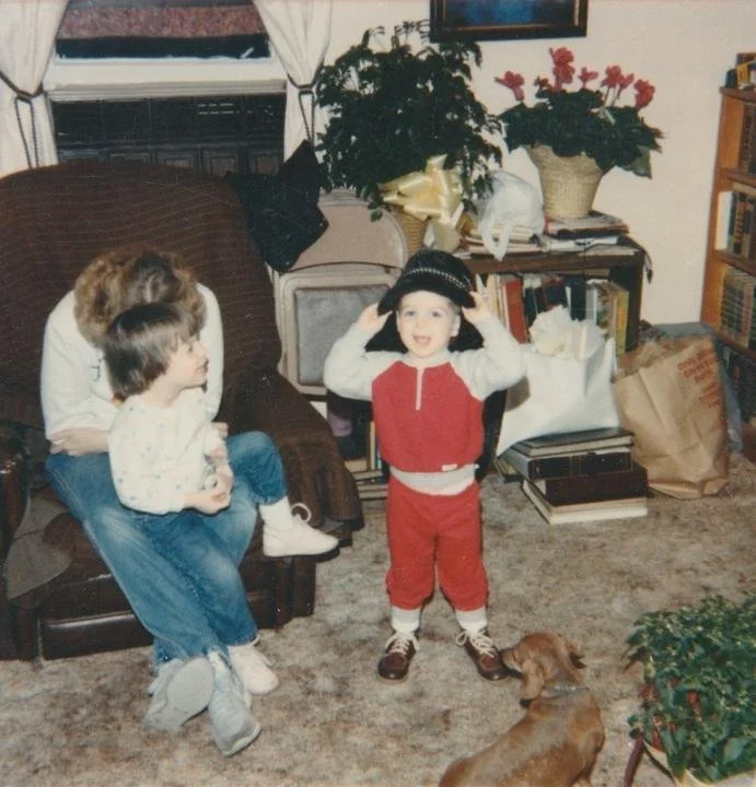 A family posing in a living room, first take