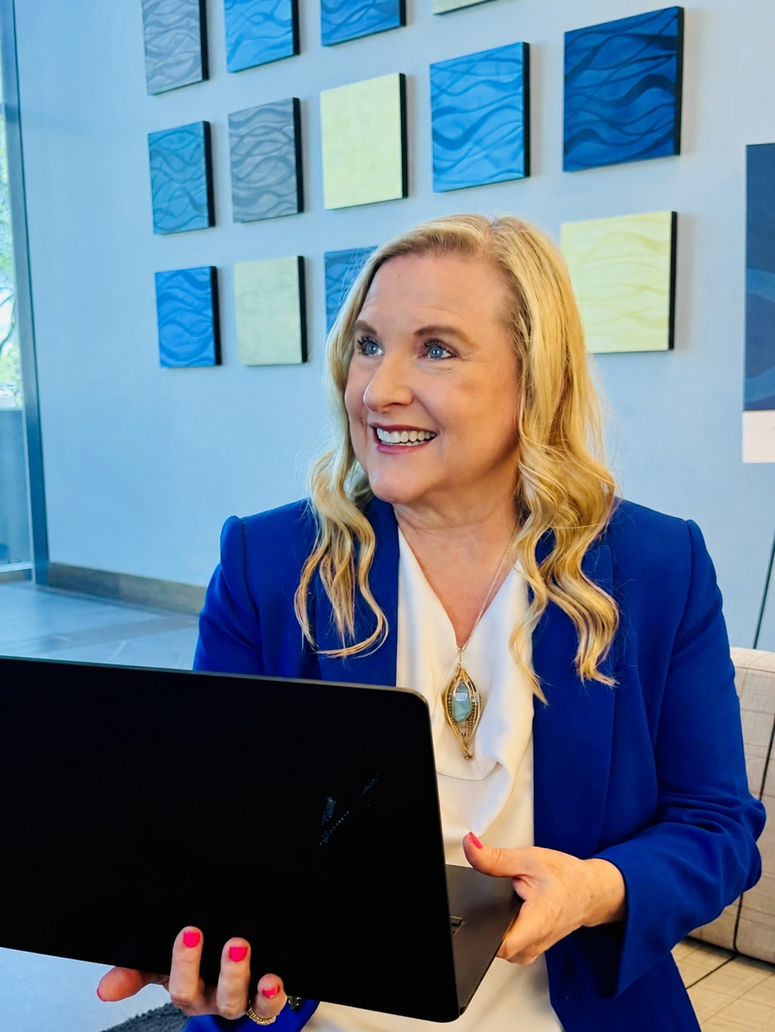 Bronwyn Davis holding a laptop