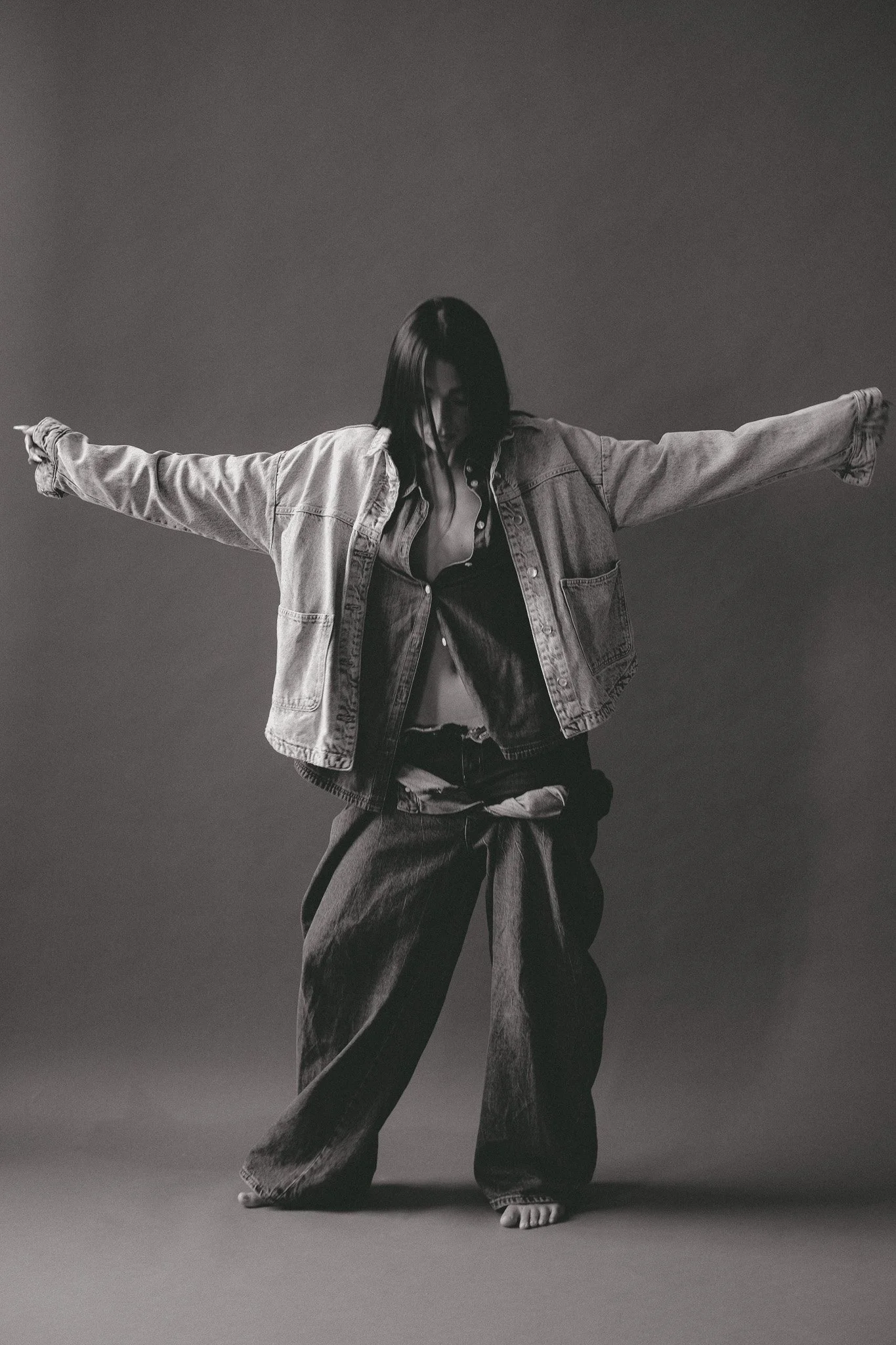 ROSIE × MINT — full-length denim fashion editorial with outstretched arms
