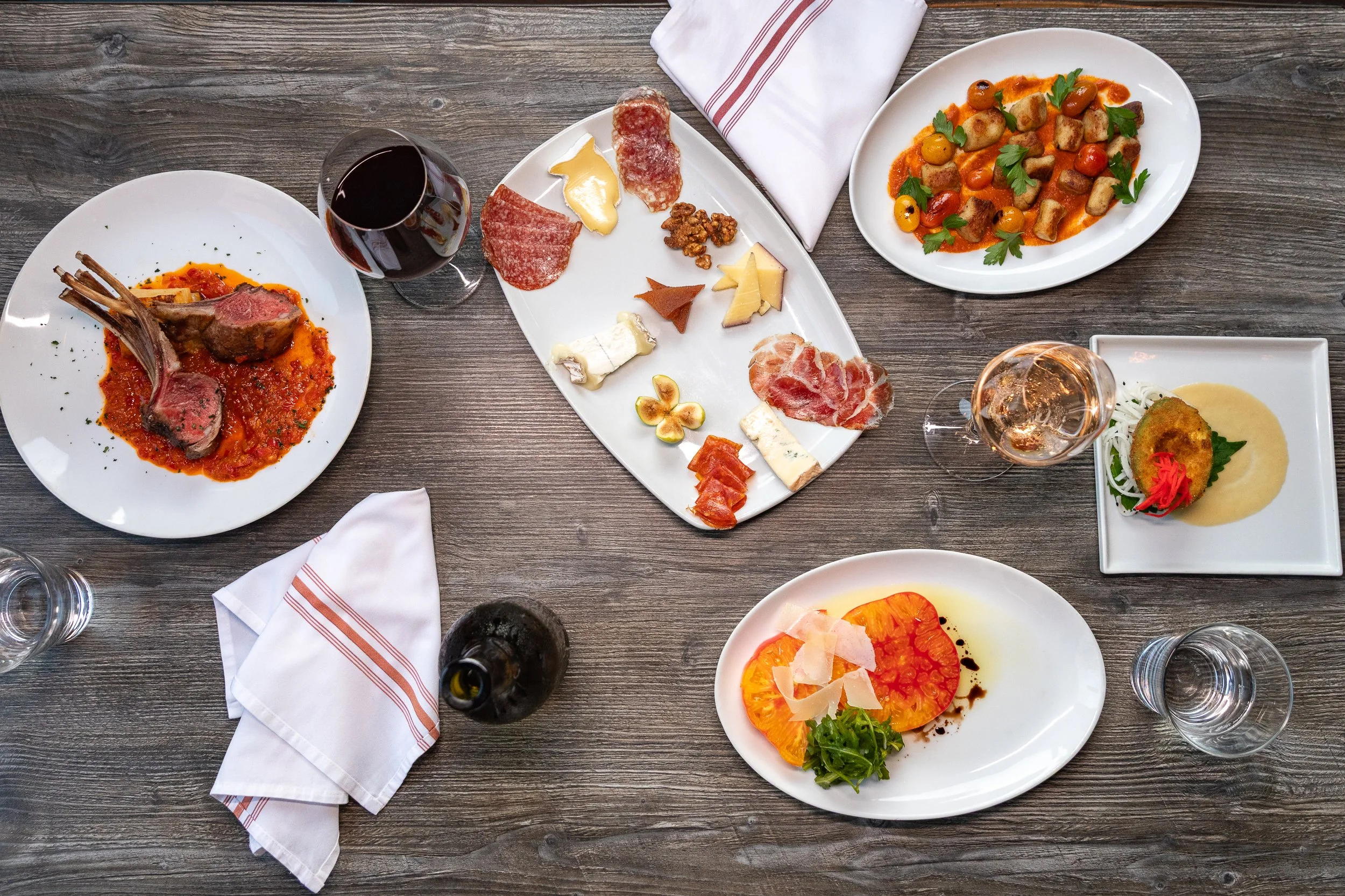 Small plates and wine on the table at Bacchus