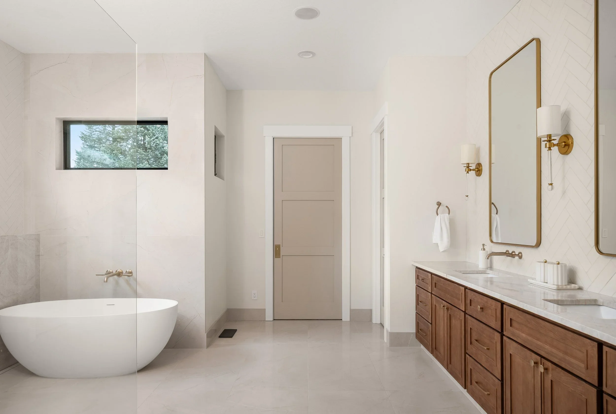 Marble-look bathroom with freestanding tub
