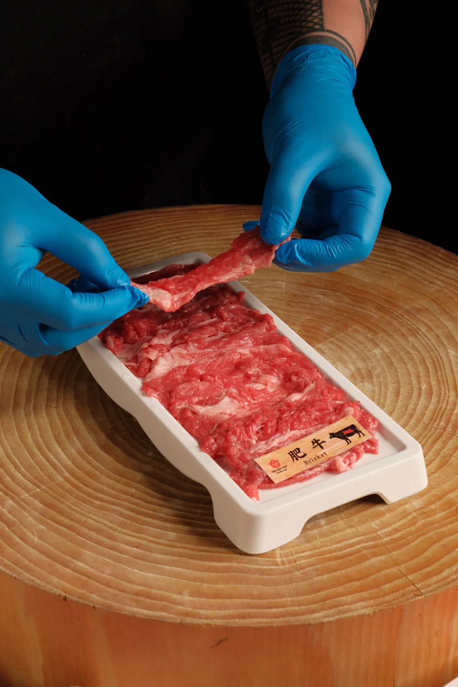 A display of fresh beef cuts at TEO Hot Pot
