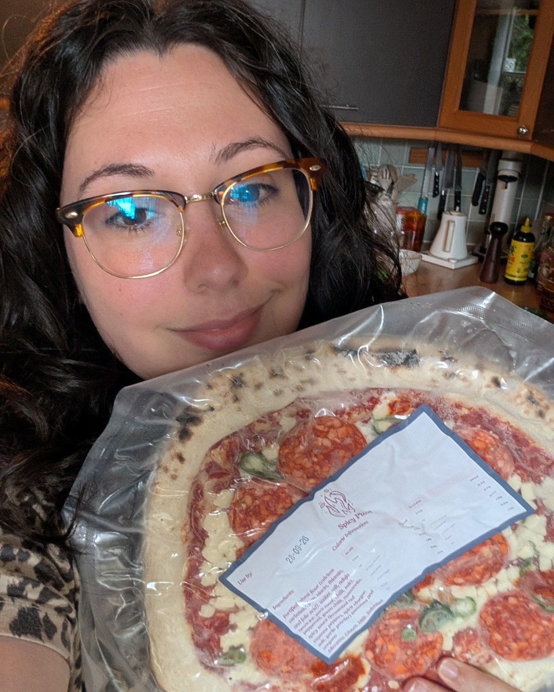 Sarah Sinclair holding an East Pizzas pizza