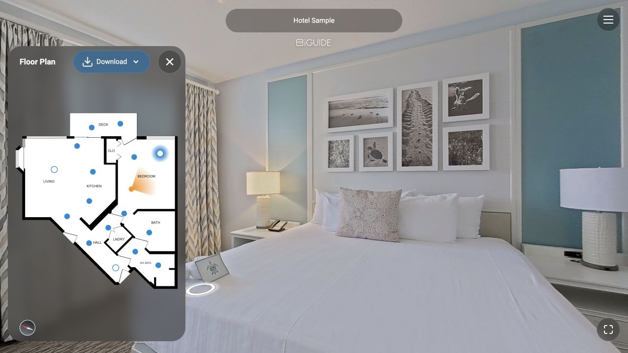 Example iGUIDE hotel suite with an interactive floor plan beside the bedroom view