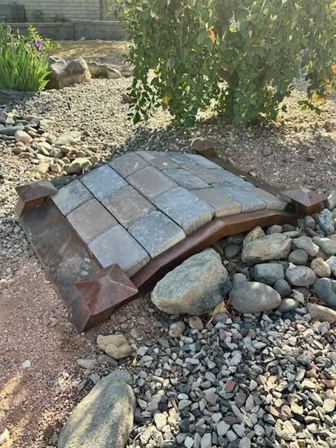 Stone bridge over a dry river rock bed
