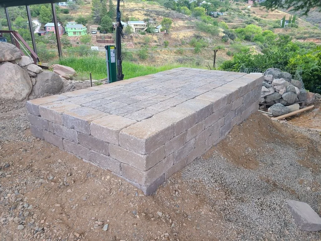 Concrete block retaining wall under construction
