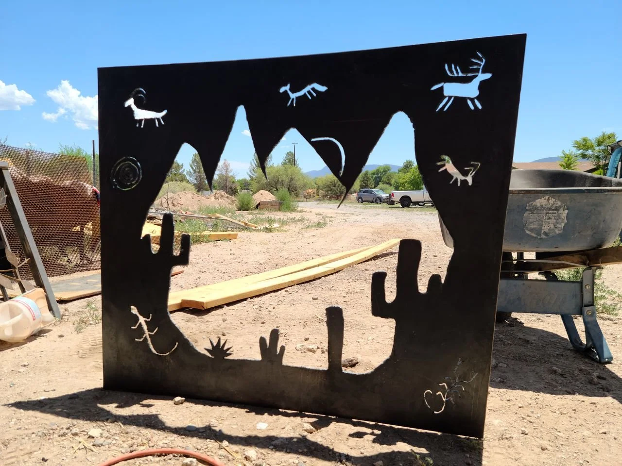 Custom iron panel with a cut desert scene