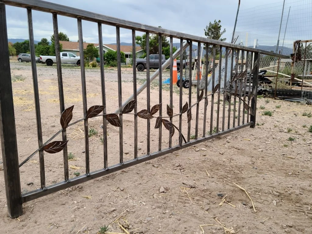 Custom steel railing with hand-cut leaf and vine detail
