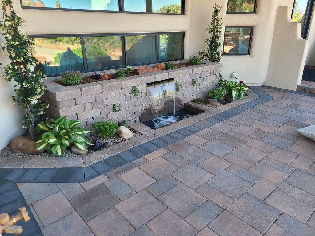 Paver patio with integrated water feature and planting