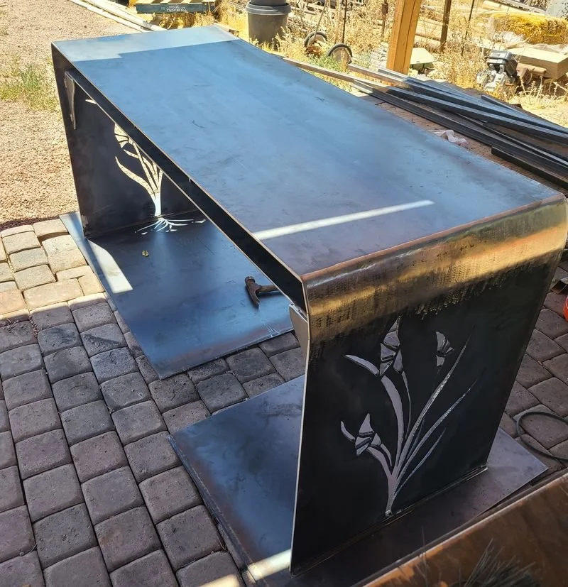 Custom steel table with iris cutout panels