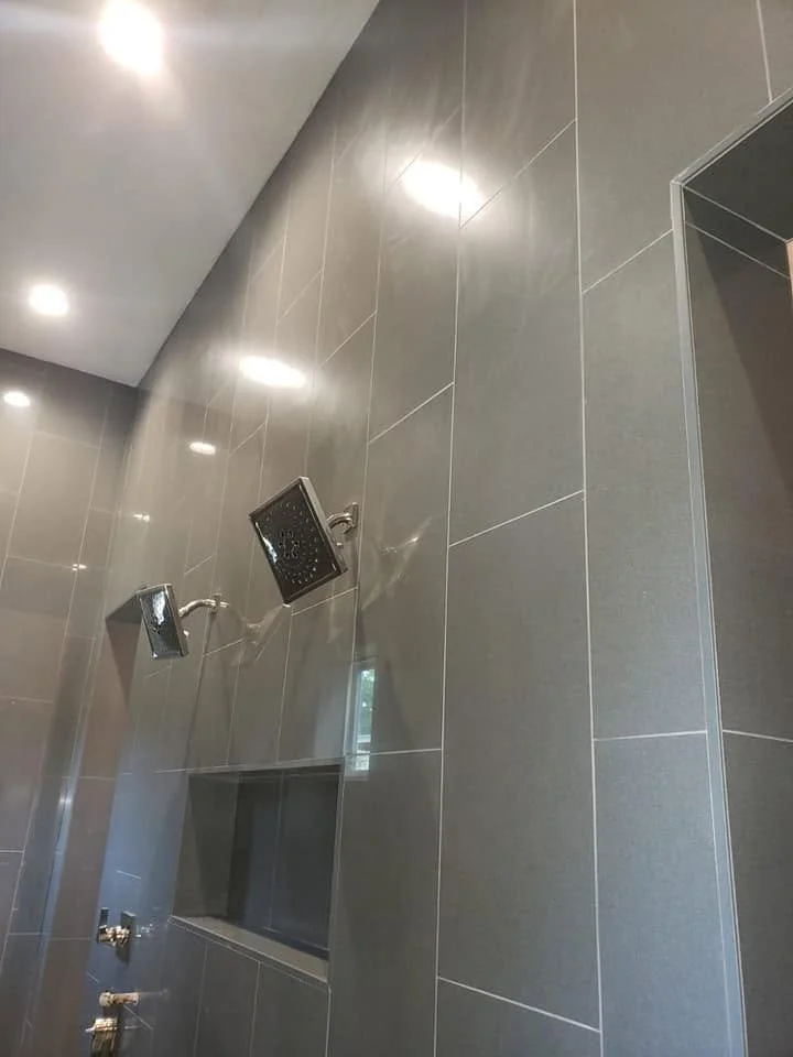 Shower tile and fixture details — EC Construction project photograph.