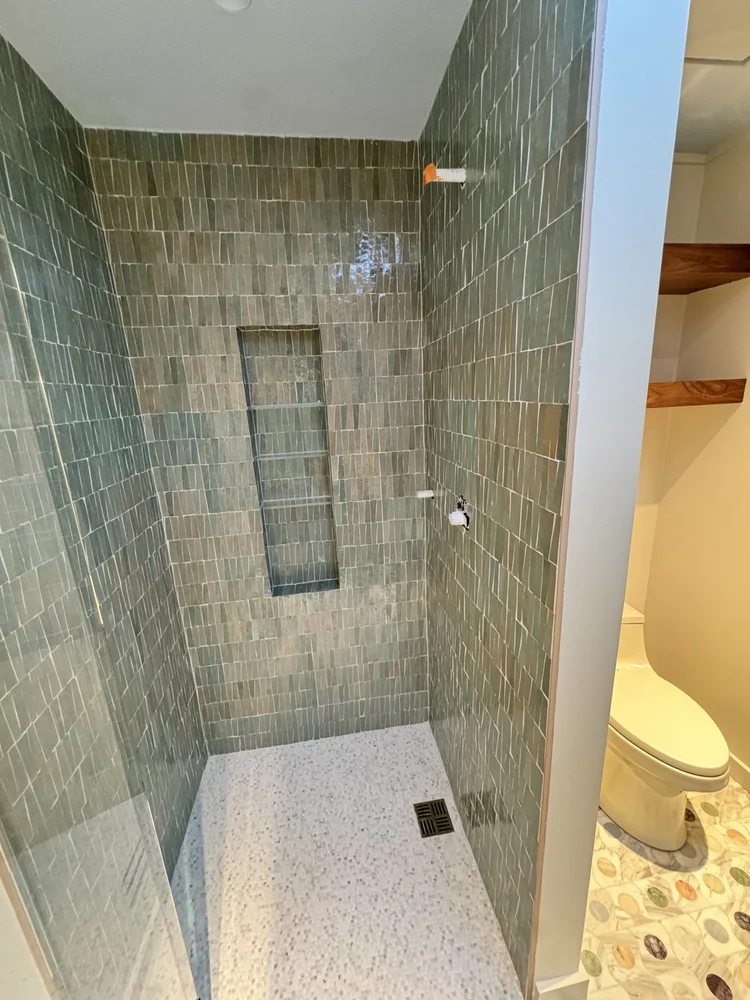 Green tile shower installation — project view.