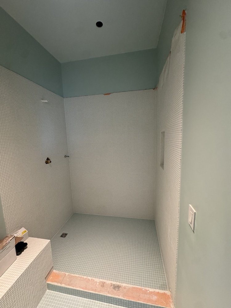 Green and white mosaic installation — project view.