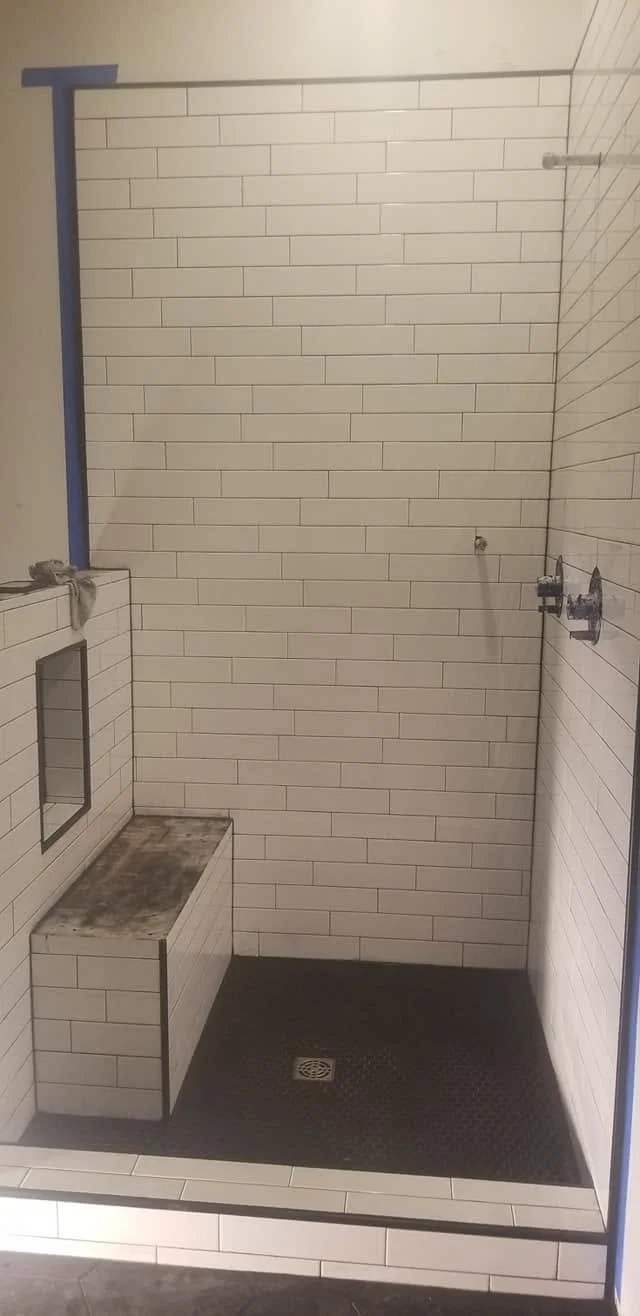 Shower tile and fixture details — EC Construction project photograph.