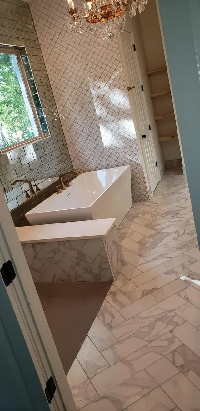 Warm brass bathroom — EC Construction project photograph.