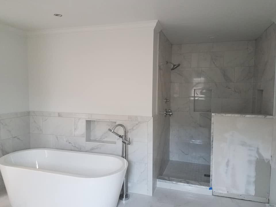 Tub and shower tilework — EC Construction project photograph.