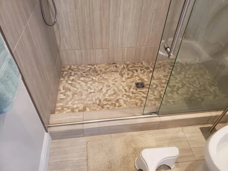 Shower tile and fixture details — EC Construction project photograph.